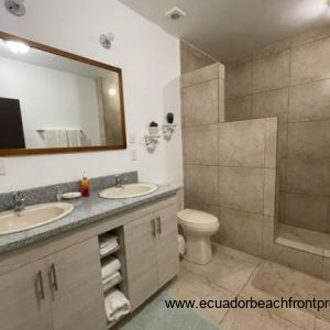 Spacious ensuite bath with double vanity and walk-in shower