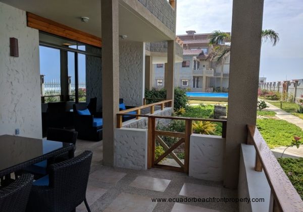 Oceanfront porch with access to pool and beach