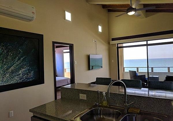Oceanview kitchen with double sinks, dishwasher, stove, oven, large capacity refrigerator with ice maker