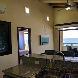 Oceanview kitchen with double sinks, dishwasher, stove, oven, large capacity refrigerator with ice maker