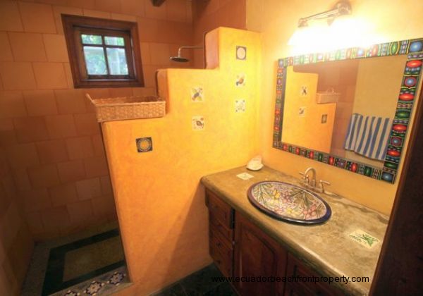 Downstairs shared bath with custom ceramic sink and walk-in shower