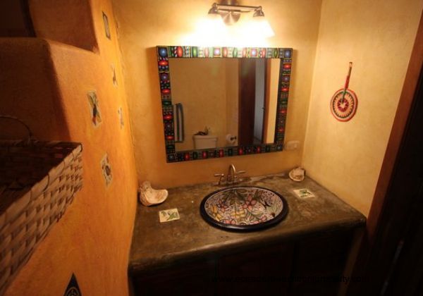 Downstairs shared bath with custom ceramic sink