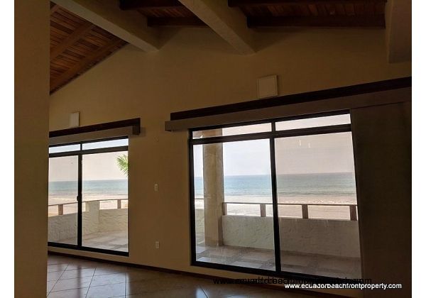 Vaulted wood ceilings and wide open views right to the beach 