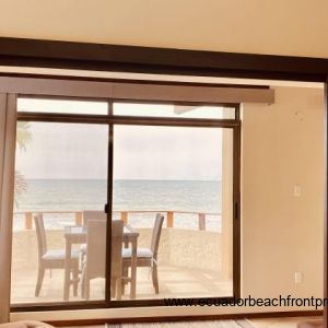 Patio doors out to the balcony that overlooks the beach.
