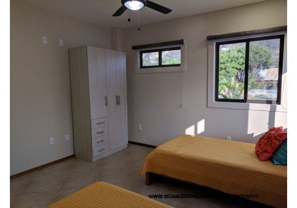 Second bedroom with twin beds and AC