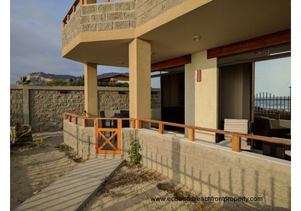 Spacious covered, beachfront patio with walkway to the beach and pool