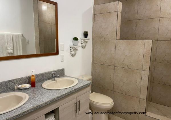 Spacious ensuite bath with double vanity and walk-in shower