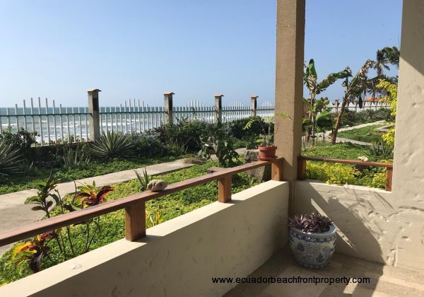 Beachfront patio with gate leading to the pool, jacuzzi, and beach