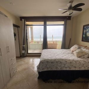 Third bedroom with closet and beach view.