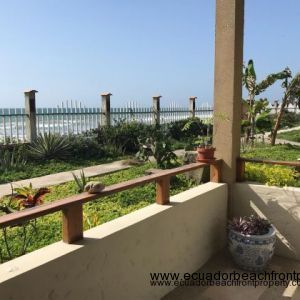 Beachfront patio with gate leading to the pool, jacuzzi, and beach