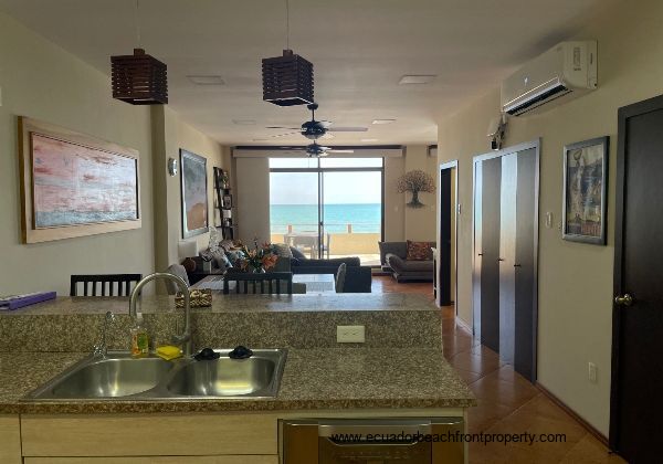 well-equipped kitchen opens to dining and living area