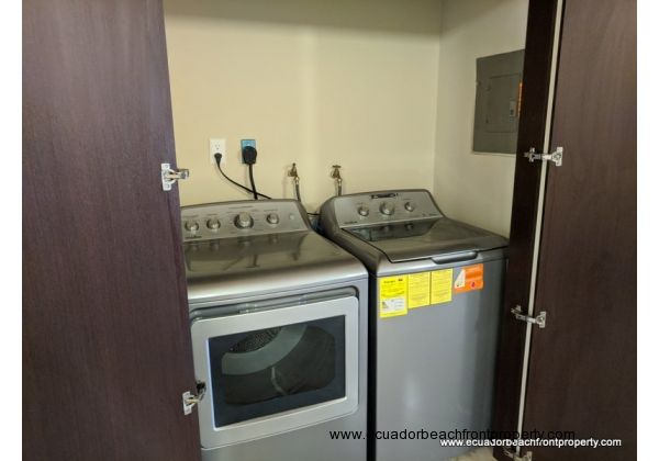 Laundry closet with washer and dryer