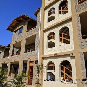 Mediterranean style face with split-faced block, wood details and a ceramic tile roof