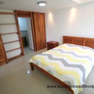 Master bedroom with ensuite bath and quality hardwood furnishings