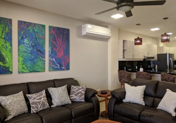 Kitchen opens to the living room with double reclining sofas