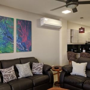 Kitchen opens to the living room with double reclining sofas