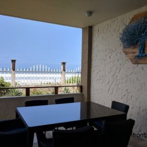 Oceanfront porch has a dining table for 6