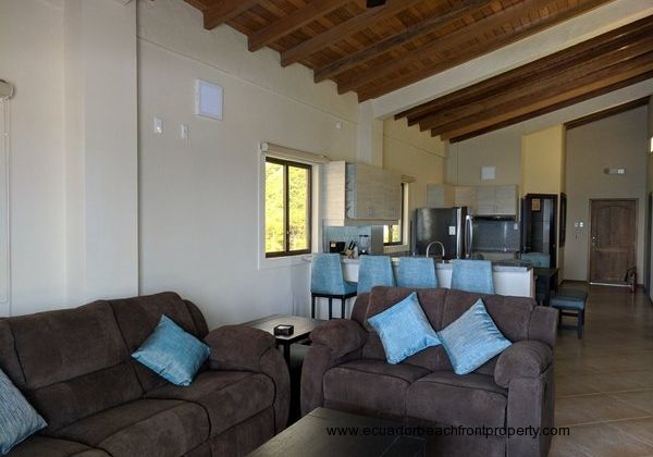 Kitchen opens to the living room with double reclining sofas