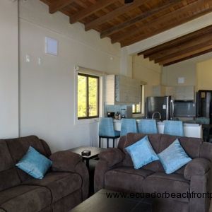 Kitchen opens to the living room with double reclining sofas