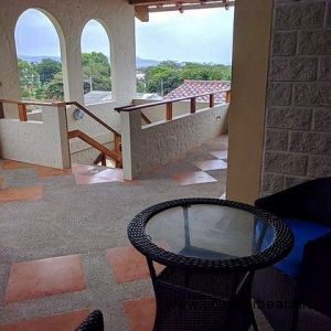 Private seating area at the front entrance to the penthouse with beautiful views of the hills