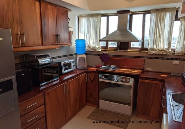 Well-equipped kitchen with wood cabinetry