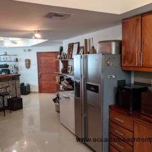 Extensive kitchen opens to a bar