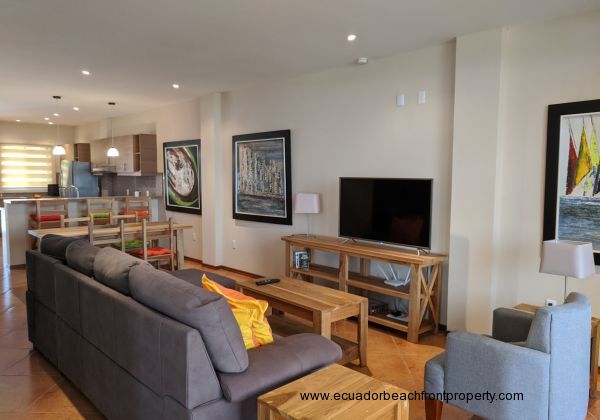 Living area of the open plan layout of this delightful condo.