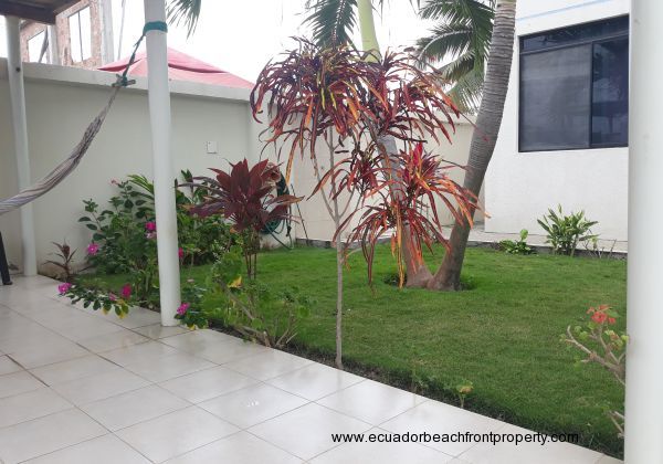 The mature, well kept gardens beside the pool area.