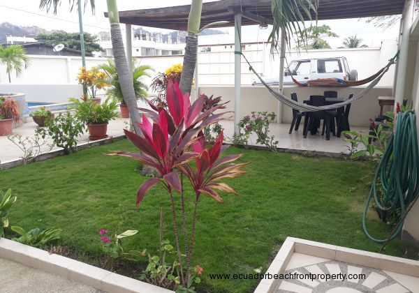 A covered patio where you can enjoy relaxing in a hammock in the shade.