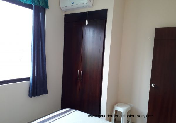 Built in closet and air conditioning unit in 3rd bedroom.
