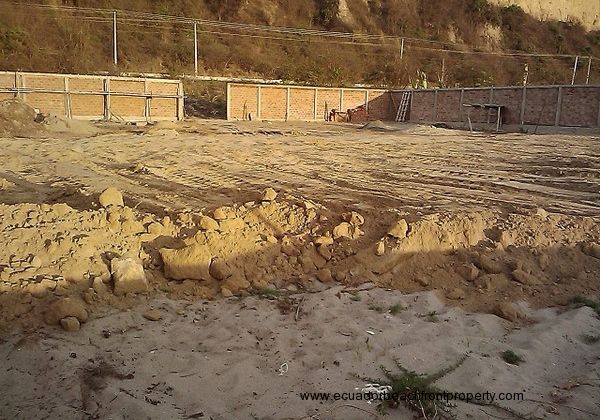 The lot as it was being filled and compacted according to building specifications