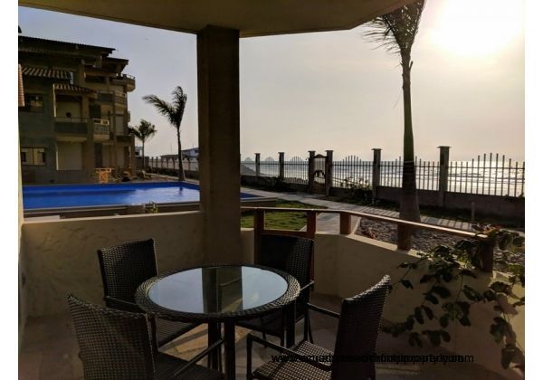 Gorgeous covered patio just steps to the 60 ft pool and beach