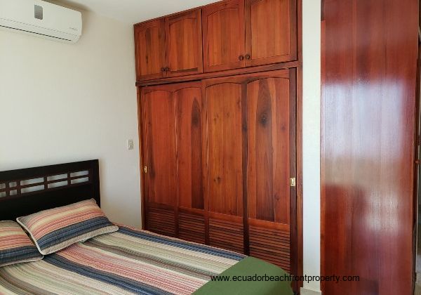 master bedroom with hardwood closets