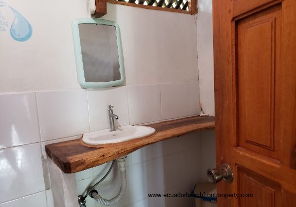 bath with hardwood countertop