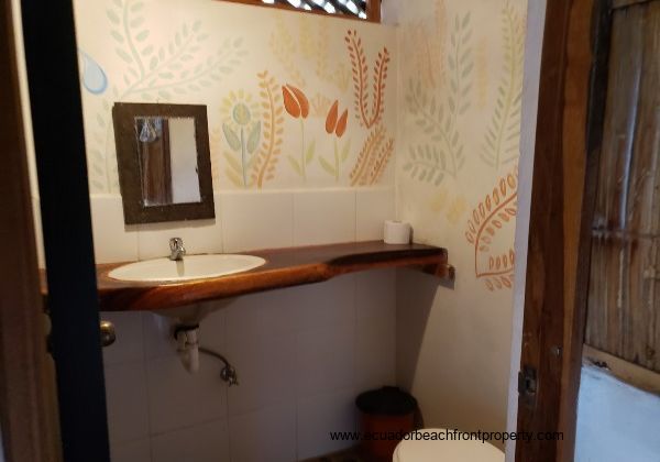 bath with hardwood countertop