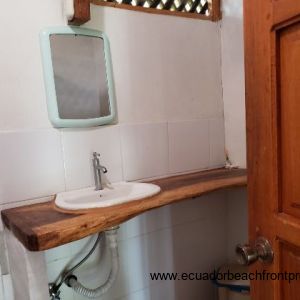 bath with hardwood countertop