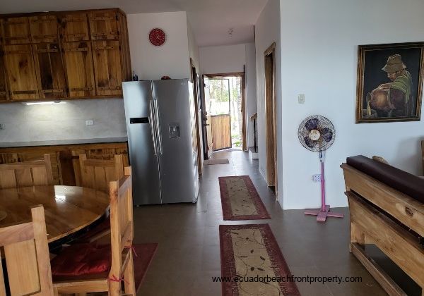 Kitchen leading to ground level bedroom