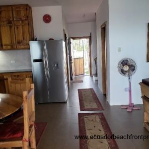 Kitchen leading to ground level bedroom