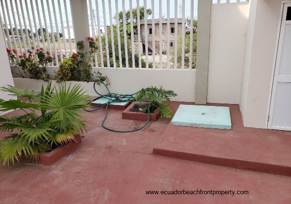 Two below-ground cisterns for receiving municipal water 