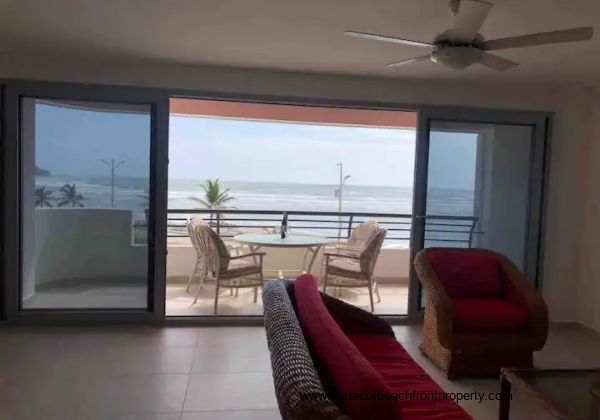 Living room opens up to the spacious oceanfront balcony