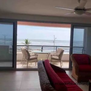 Living room opens up to the spacious oceanfront balcony