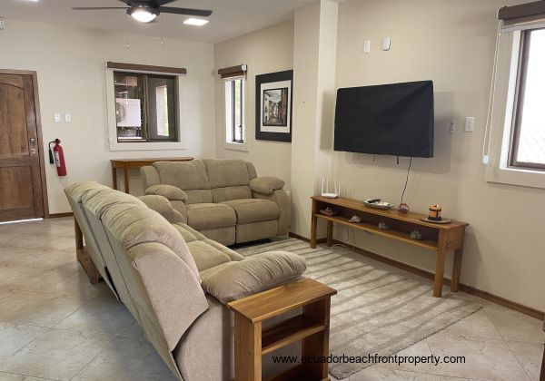 living room with reclining sofas