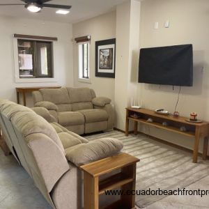 living room with reclining sofas