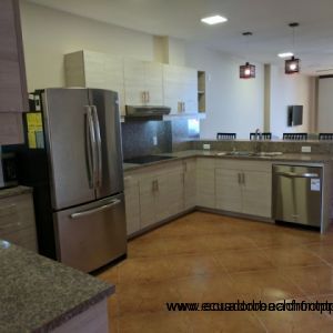 Spacious kitchen equipped with stainless appliances