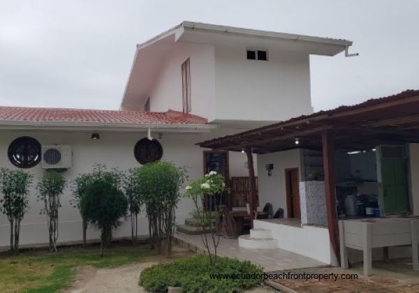 Ocean front side of home with large front patio