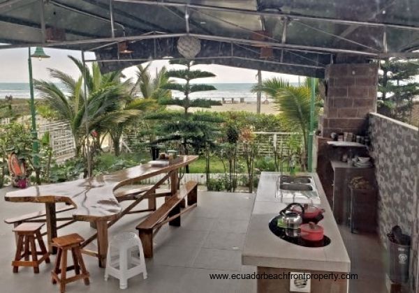 Ocean view patio with outdoor kitchen and dining