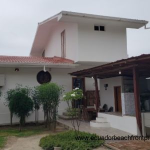 Ocean front side of home with large front patio