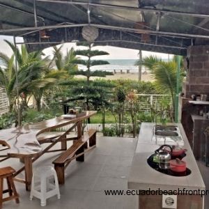 Ocean view patio with outdoor kitchen and dining