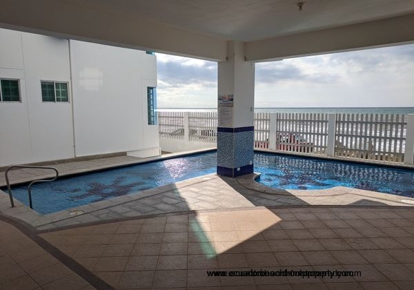 Covered deck looking out to the ocean by the pool.
