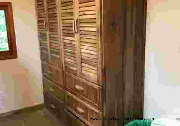 linen closet/armoire in the ensuite bath